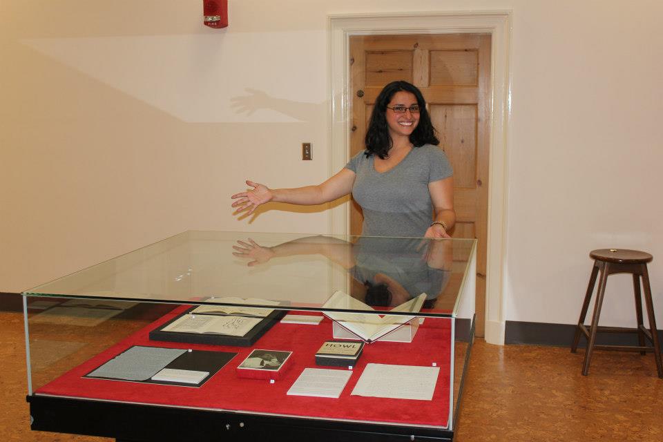 Photograph of Museum Studies student Bre Wasinger in front of the case she developed on Allen Ginsberg. 