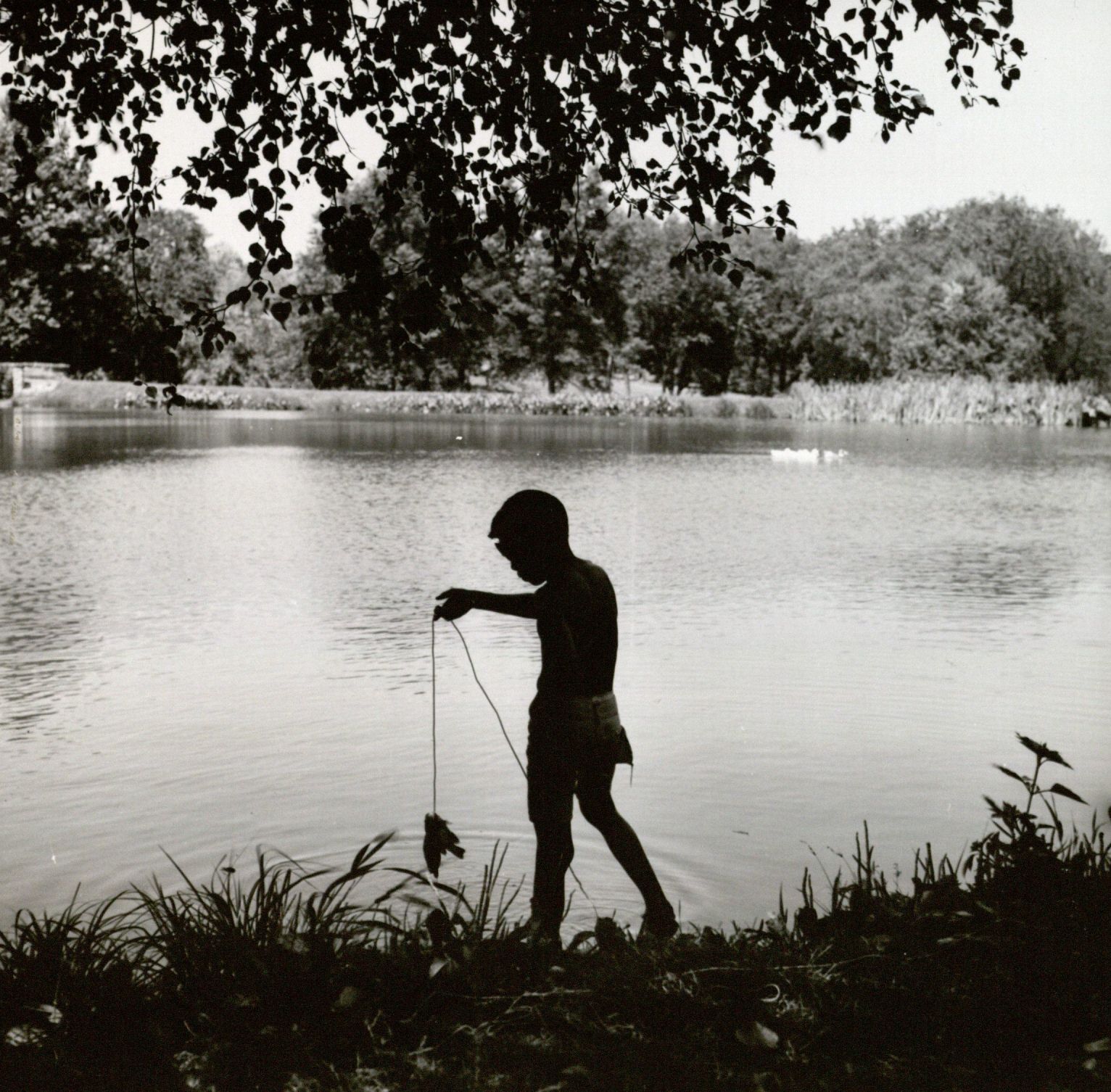 Photograph of boy fishing at Potter Lake in the 1970s.