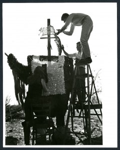 Photograph of students constructing a homecoming float.