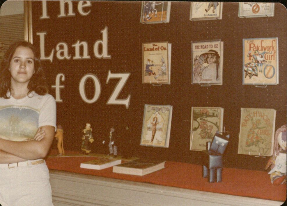 Image of Jane Albright in front of Oz exhibit at KSRL, 1977