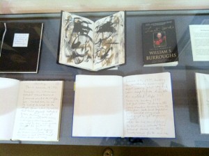 Image of display case containing five of William S. Burroughs' last journals, as seen from above.