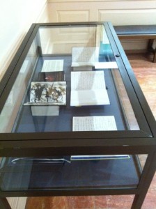 Image of display case containing five of Burroughs' last journals