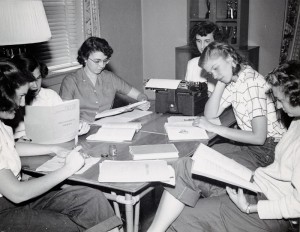Photograph of group of female students studying, 1950s. 
