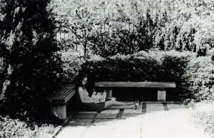 Photograph of student studying under trees, 1969-1970.