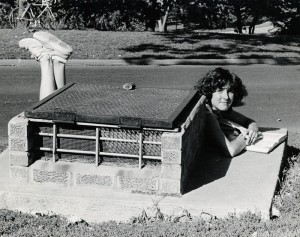 Photograph of student studying behind grate, 1979-1980.