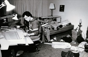 Photograph of student working in his room, 1982-1983. 