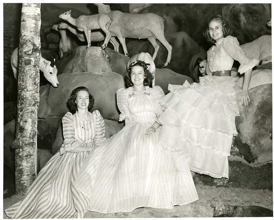 Women posing in a section of the diorama in the newly reopened Dyche Museum, 1941
