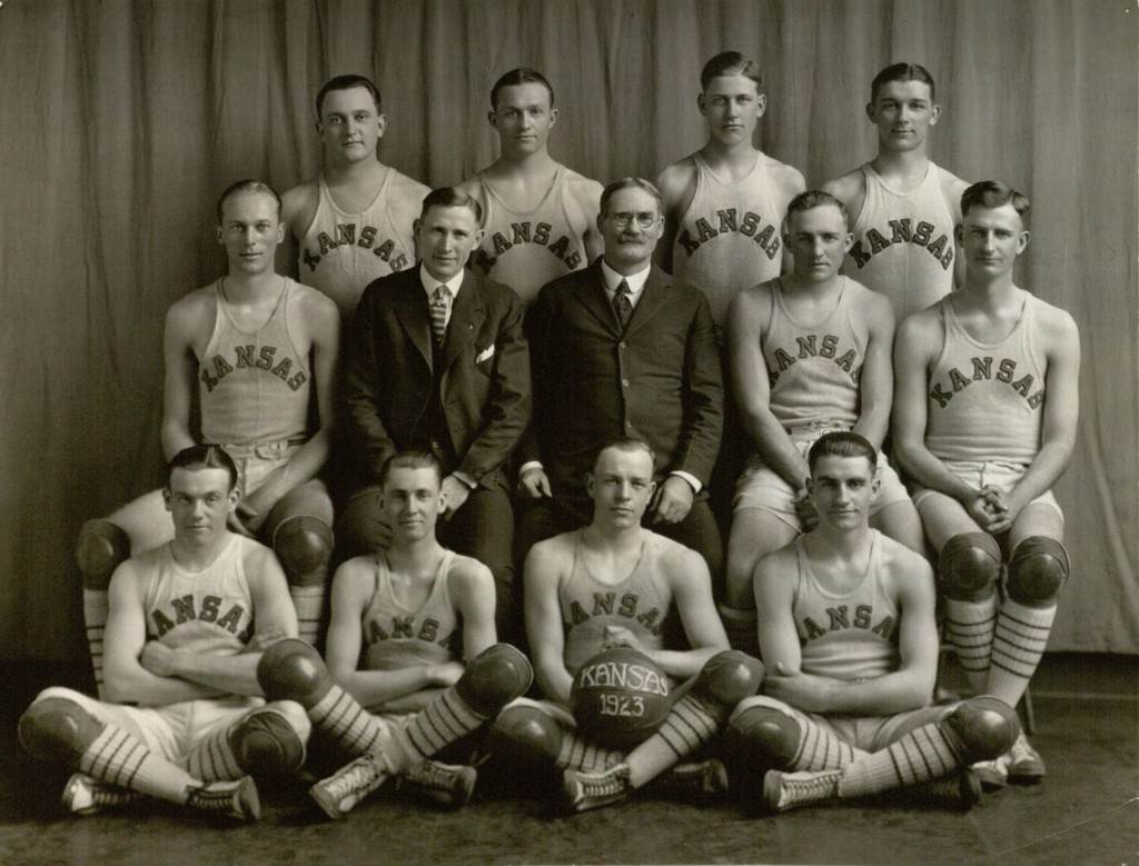 Photograph of KU men's basketball team with Adolph Rupp, Phog Allen, and James Naismith, 1922-1923