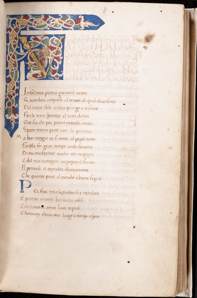 Opening of Petrarch's Canzoniere, featuring an illuminated initial containing white vine on a blue background, from A manuscript collection of Italian lyric poetry; primarily Petrarch’s Canzoniere. Italy, 15th century.