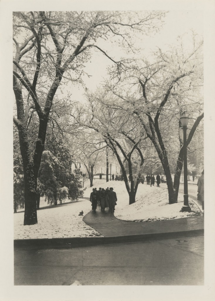 Photograph of Students walking along Jayhawk Boulevard in the snow, 1936-1937