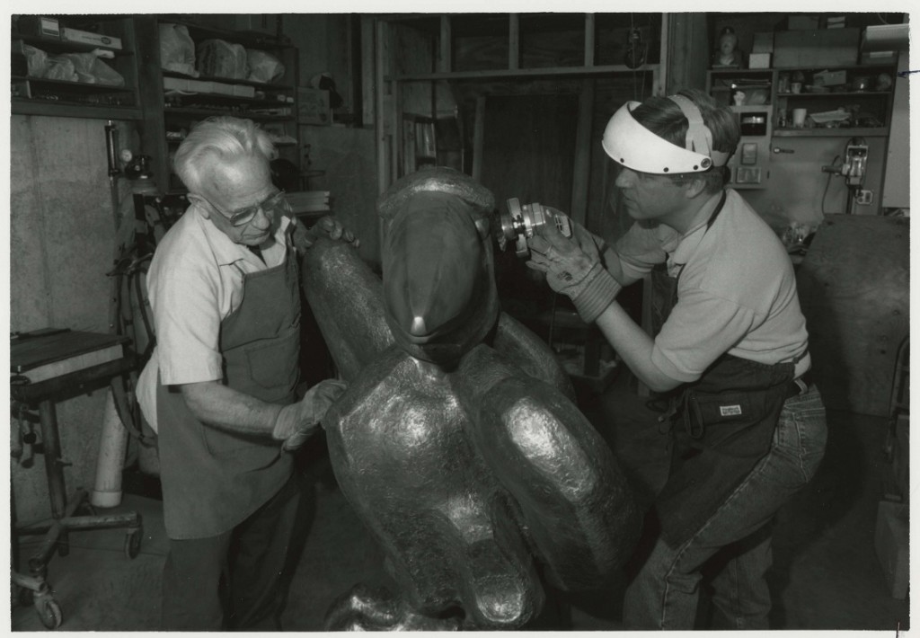 Photograph of Elden Tefft and his son Kim repairing "Academic Jay," 1996