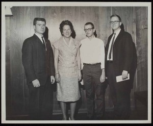 1964 Contest Winners Laird Wilcox, Lawrence Morgan, and Jerry L. Ulrich, with Elizabeth M. Taylor.