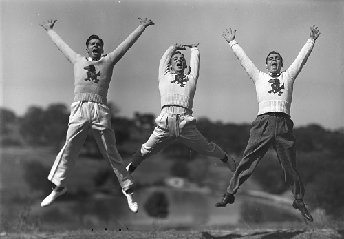 Photograph of KU cheerleaders jumping in the air, 1938-1939