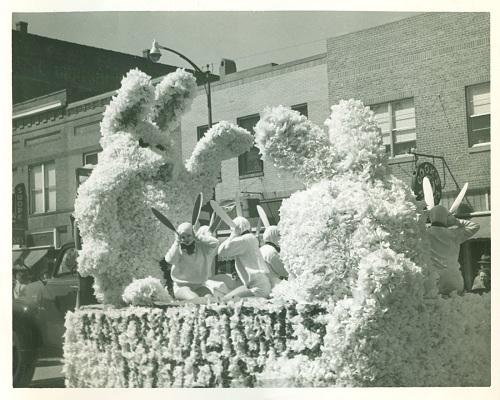 Photograph of the Kansas Relays parade, float with people dressed as rabbits, 1953