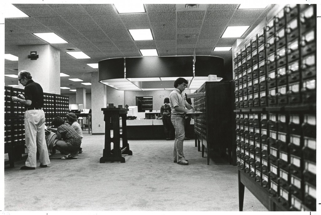 Photograph of patrons using the card catalog at Watson, 1981