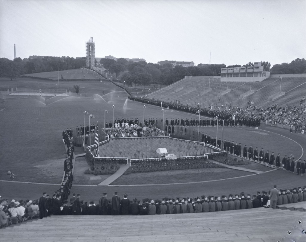 Photograph of KU graduates walking down the hill to Memorial Stadium, 1950s