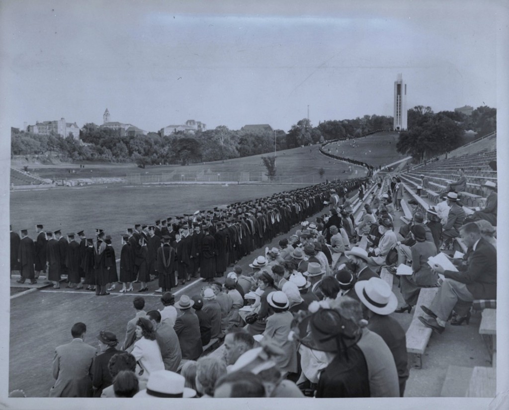 Photograph of KU graduates walking down the hill to Memorial Stadium, 1950s