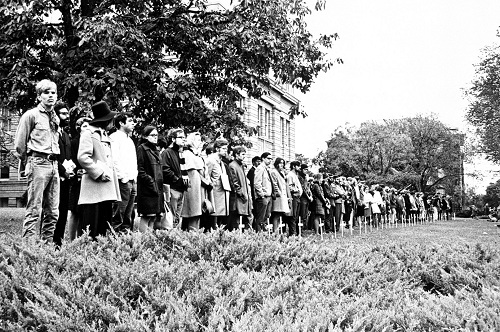 Photograph of protestors lined up behind white crosses, October 15, 1969 