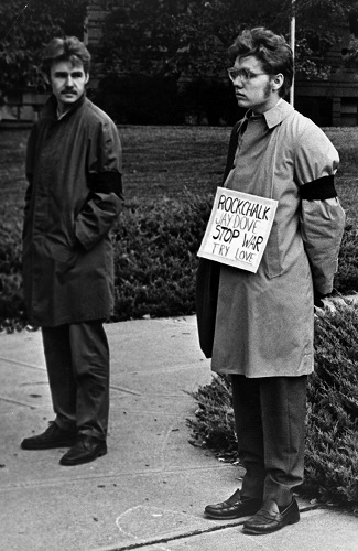 Photograph of two men silently protesting on campus, October 15, 1969