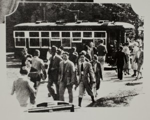 Students exiting streetcar, KU Campus