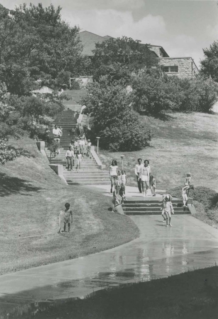Photograph of children and adults from Hilltop Day Care walking down Mount Oread, undated