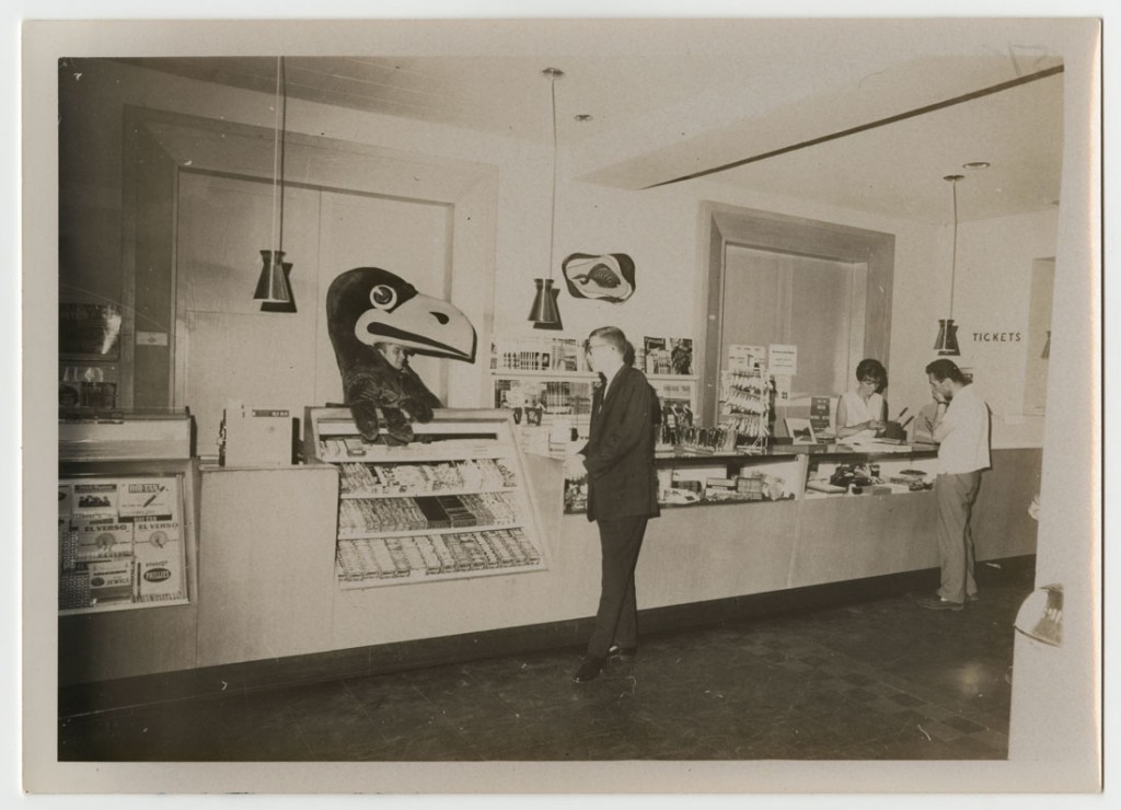 Photograph of the Jayhawk mascot hanging out behind the counter in the union store, 1963/1964