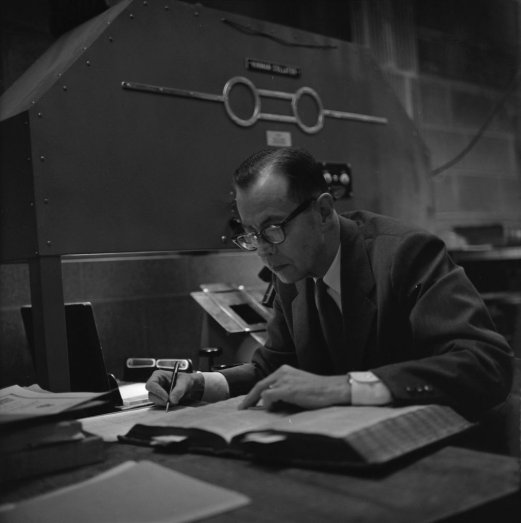 Photograph of Charlton Hinman working at his desk, circa 1960-1975