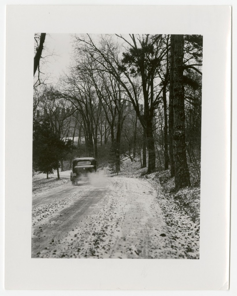 Photograph of a car driving down Memorial Drive, 1940s