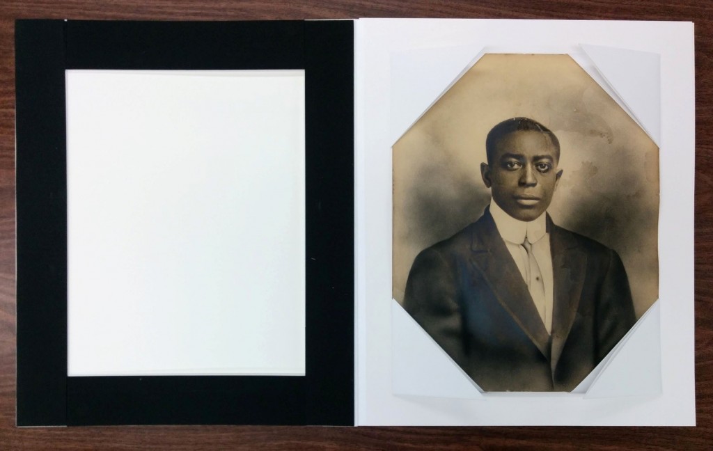 Photograph of Fred Thompson, housing with foam-lined window mat, undated