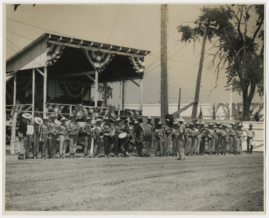 Photograph of the KU Cowboy Band in front of a bandstand, 1941-1942