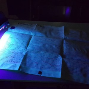 Examination of parchment under ultraviolet light.