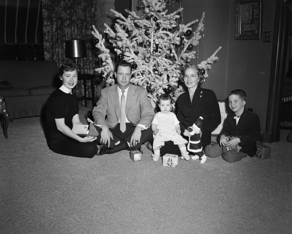 Photograph of the Phog Allen family in front of a Christmas tree, circa 1955