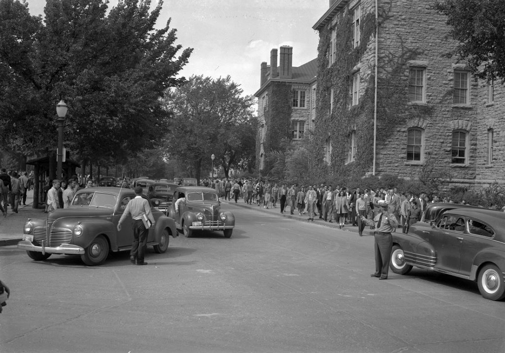 Photograph of KU students walking between classes, 1940-1949