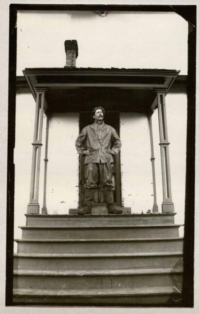 Photograph of Louie C. Walbridge on porch of his home, 1884