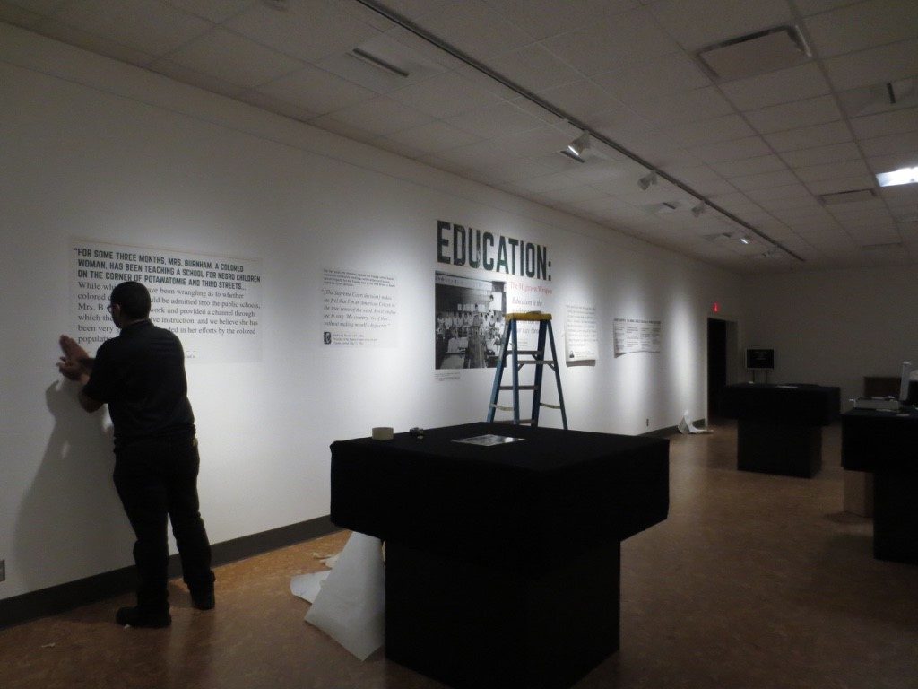 Setting up the Education exhibit