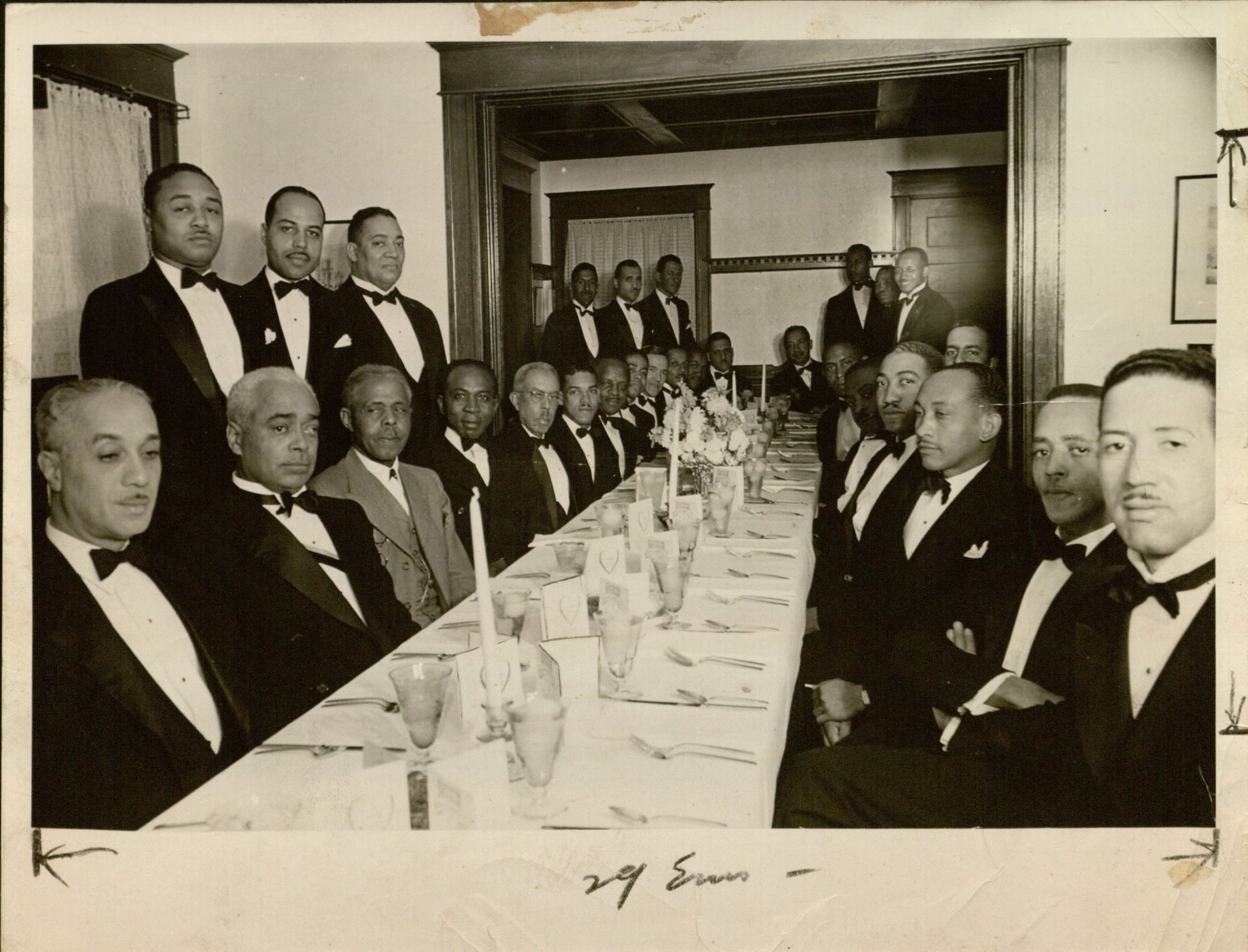 A photograph of members belonging to the Alpha Phi Alpha Fraternity at a banquet from the Dorothy McField collection of sorority and fraternity papers. African American Experience Collection, Spencer Research Library.