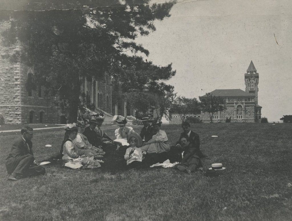 Photograph of students relaxing on campus, 1900-1909