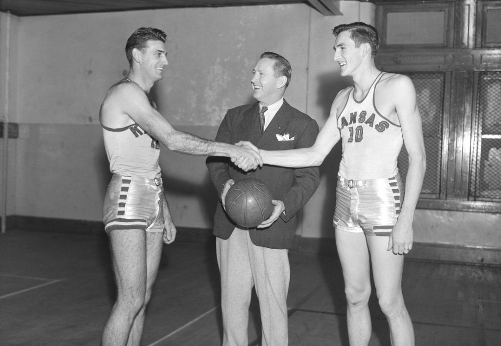 Photograph of Phog Allen with two KU basketball players, 1947