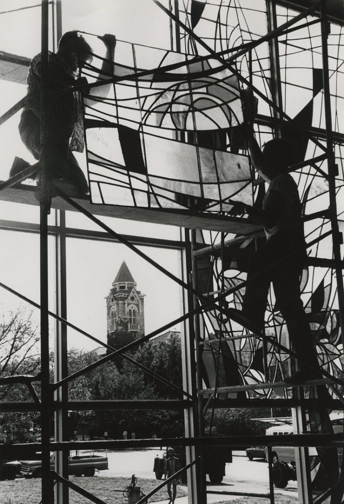 Photograph of workers installing stained glass windows in Smith Hall, 1967