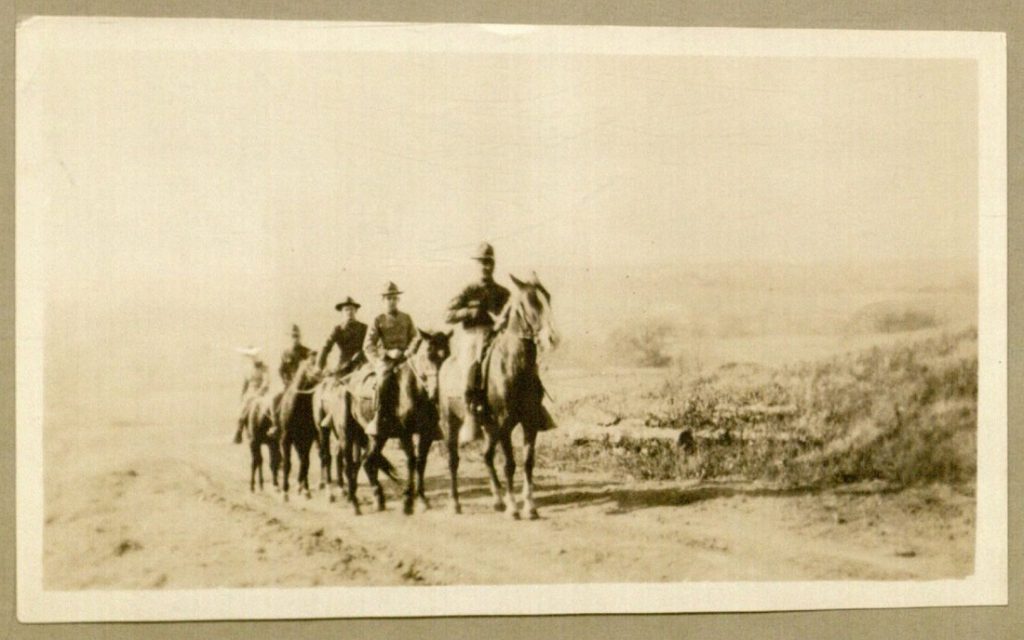 Photograph of men on horses, enclosed with Forrest W. Bassett letter to Ava Marie Shaw, November 11, 1917