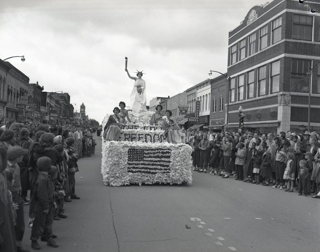 Photograph of a patriotic float in a Kansas Relays parade, 1950s