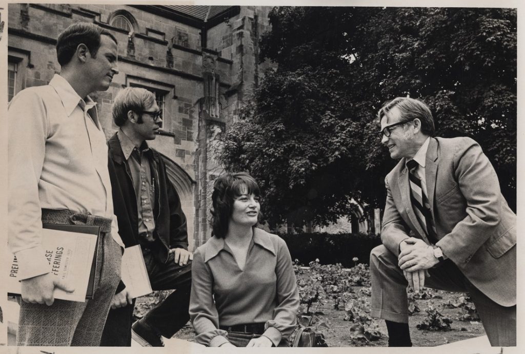 Photograph of Del Shankel with students outside Hoch Auditorium, 1973