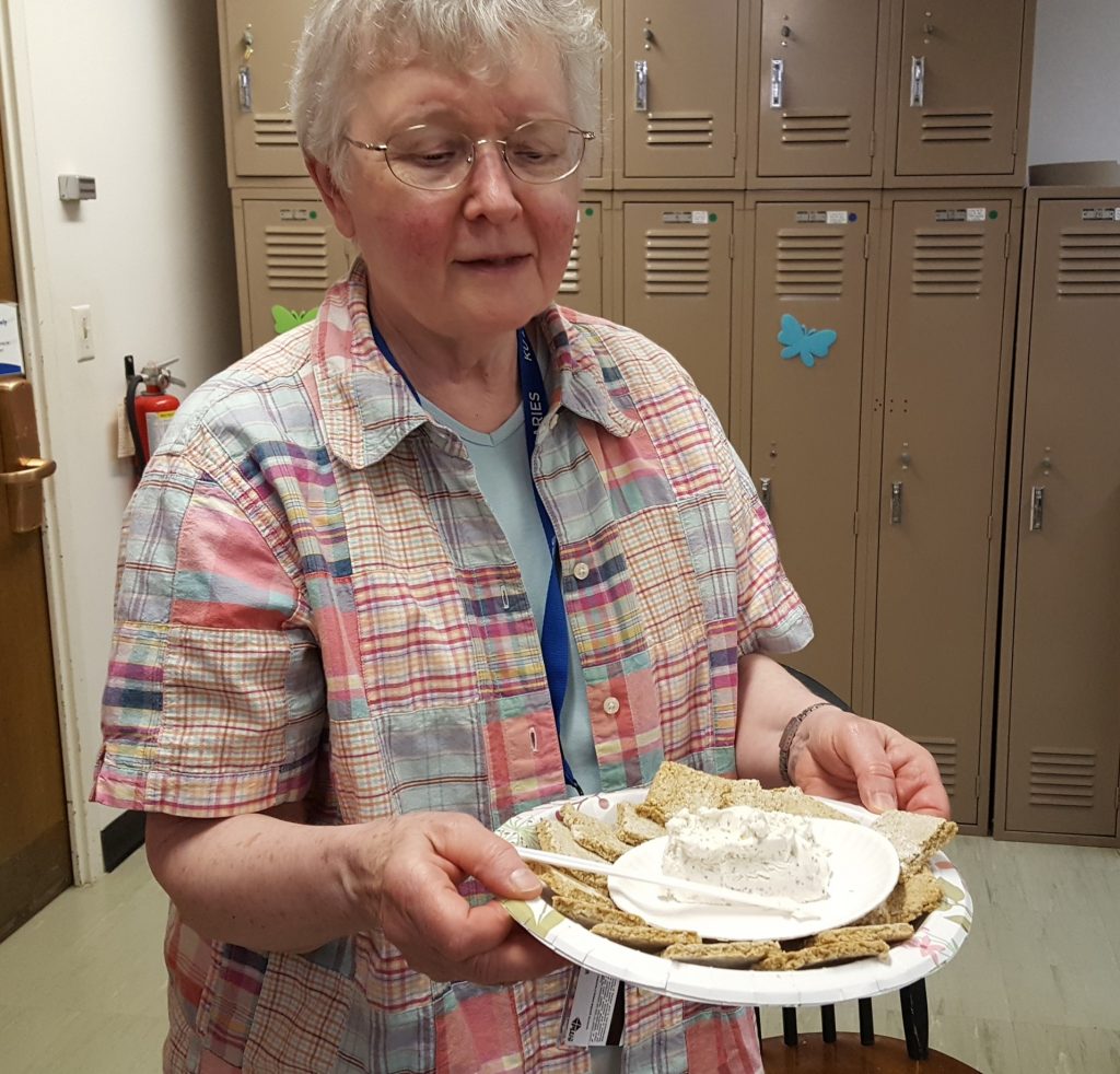 Karen Severud Cook with her oat crackers with goat cheese