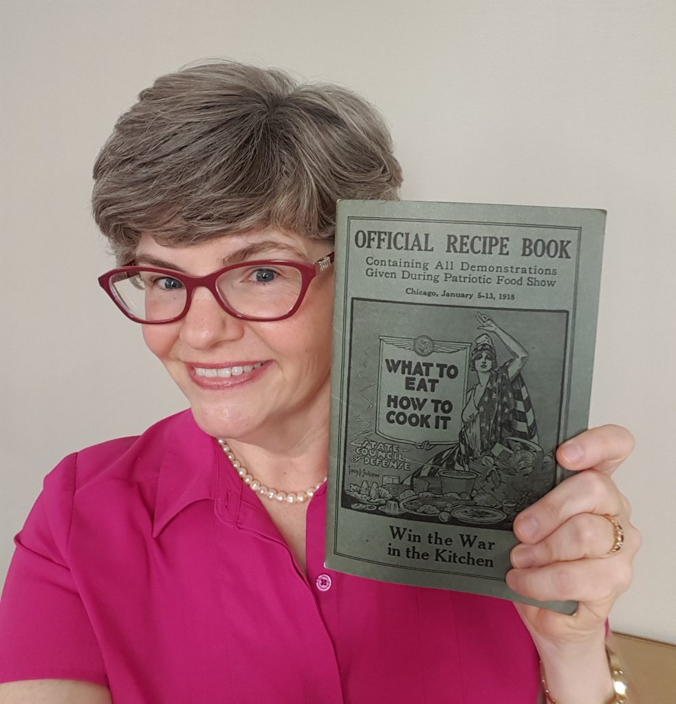 Lynn Ward with WWI recipe book.