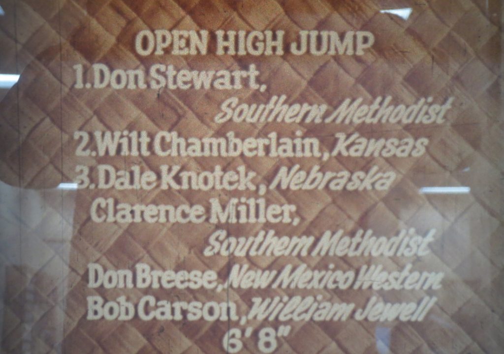 Film still of the high jump standings at the Kansas Relays, 1957