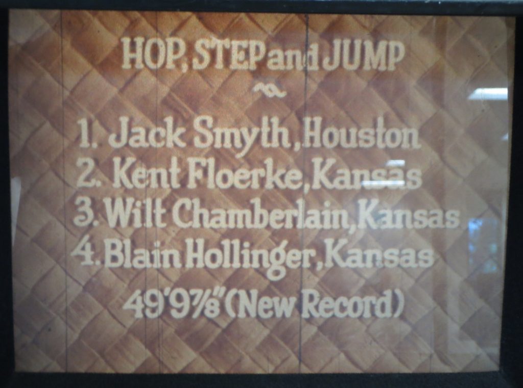 Film still showing the triple jump standings at the Kansas Relays, 1957