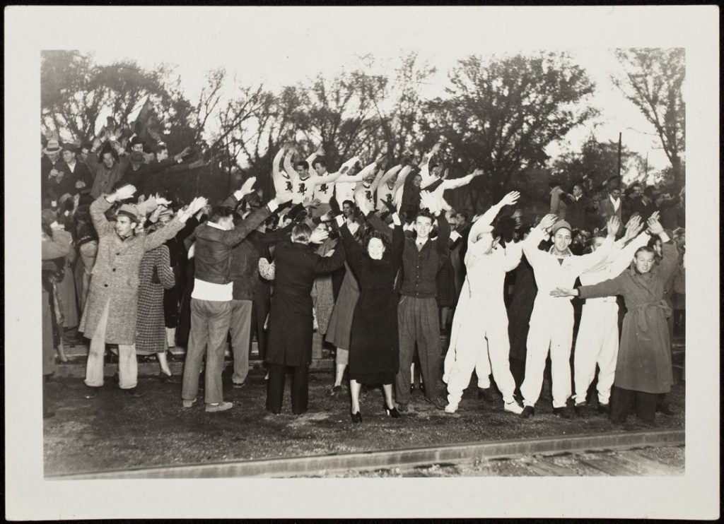 Photograph of football fans at a pep rally, 1936-1937