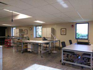 Height-adjustable, wheeled workbenches and tables in the new lab space.