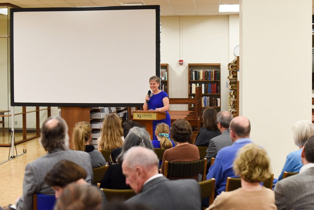 Photograph of Beth M. Whittaker speaking at Spencer Research Library's fiftieth anniversary celebration, 2018