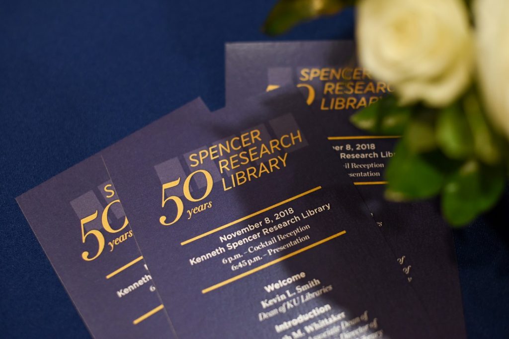 Photograph of event programs at Spencer Research Library's fiftieth anniversary celebration, 2018